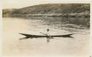 Image of Eskimo [Kalaallit] boy in kayak